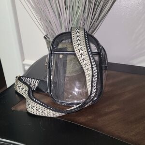 Clear Crossbody bag with wide Guitar strap.